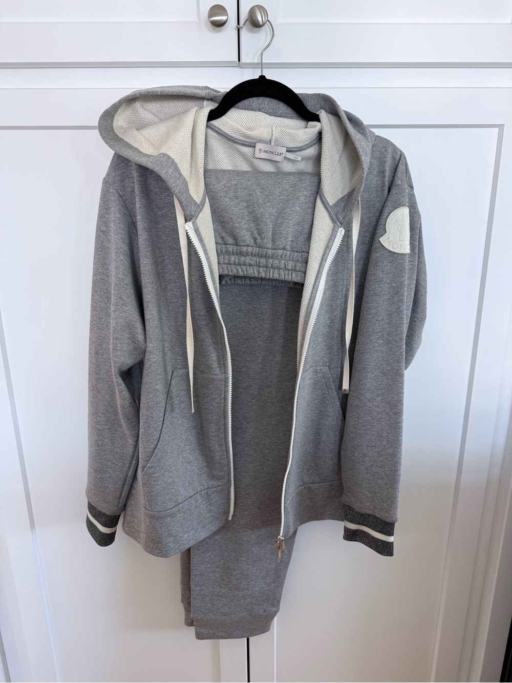 Moncler- Women’s grey hooded zip-up sweatshirt and matching drawstring pants.